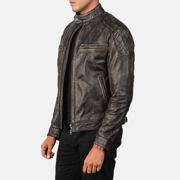 Dark leather jacket worn by a person on a white background
