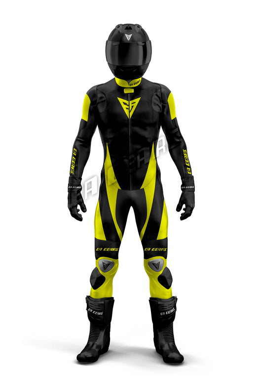 Full-length image of a professional one-piece leather motorcycle racing suit in black and bright hi-vis yellow with black racing boots and helmet. The suit features CE Level 2 armor, shoulder sliders, and knee sliders.