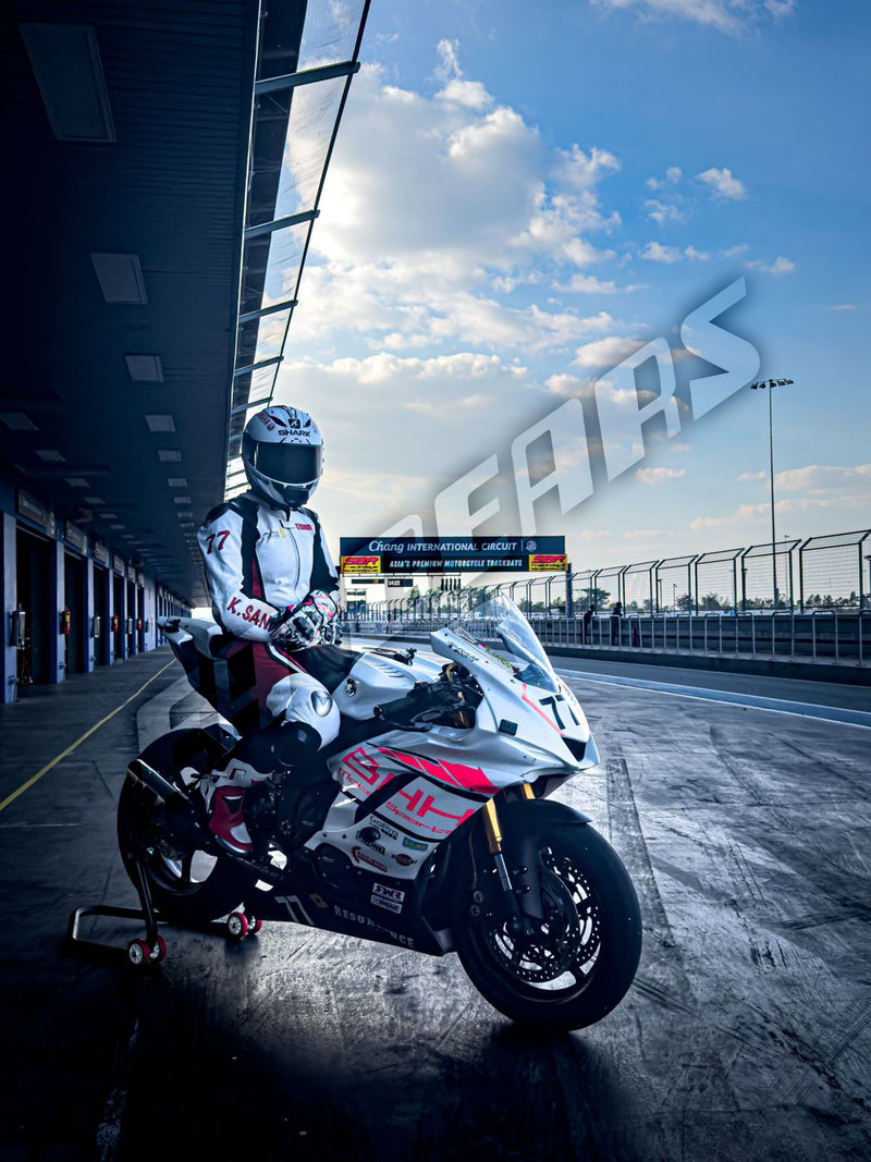 Motorcyclist on a racing bike with 'ABS' branding in the background